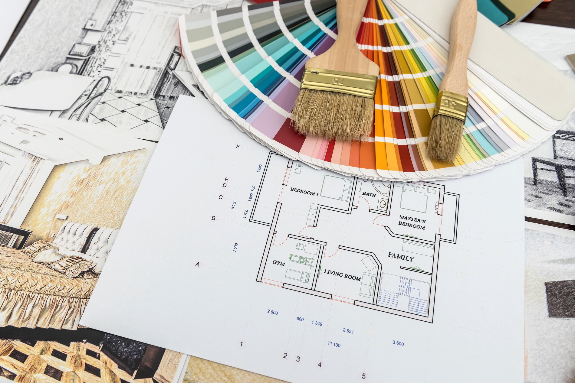 A home renovation plan, with a color wheel and paint brushes. 