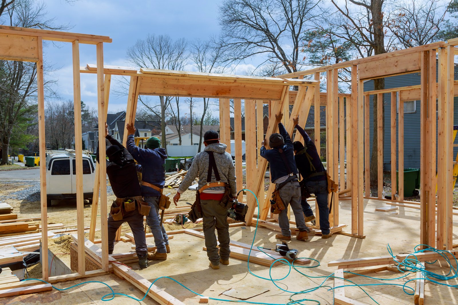 construction workers putting in doors and windows