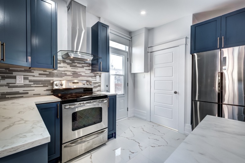 remodeled kitchen by creative property renewal - chrome appliances - lightbox