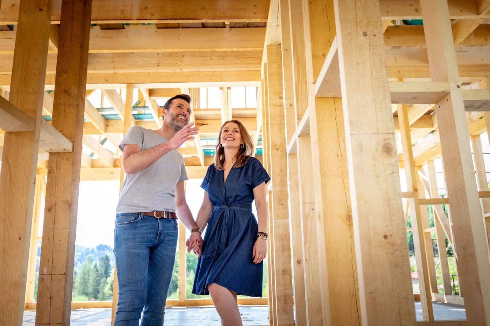 Couple reviewing wood framing during custom home construction in Stockton CA